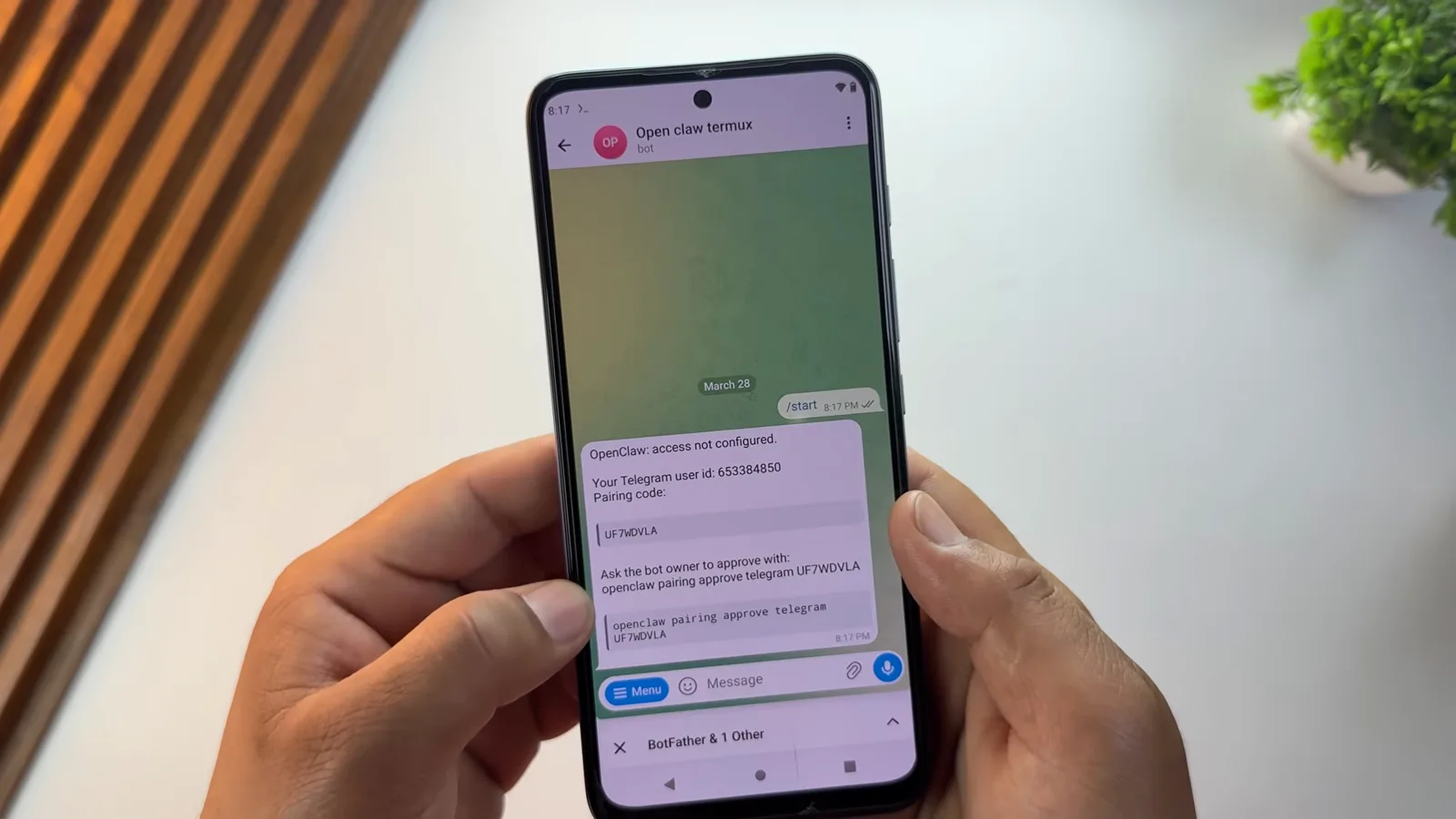 OpenClaw Telegram bot replying with the pairing code and the openclaw pairing approve telegram command to copy