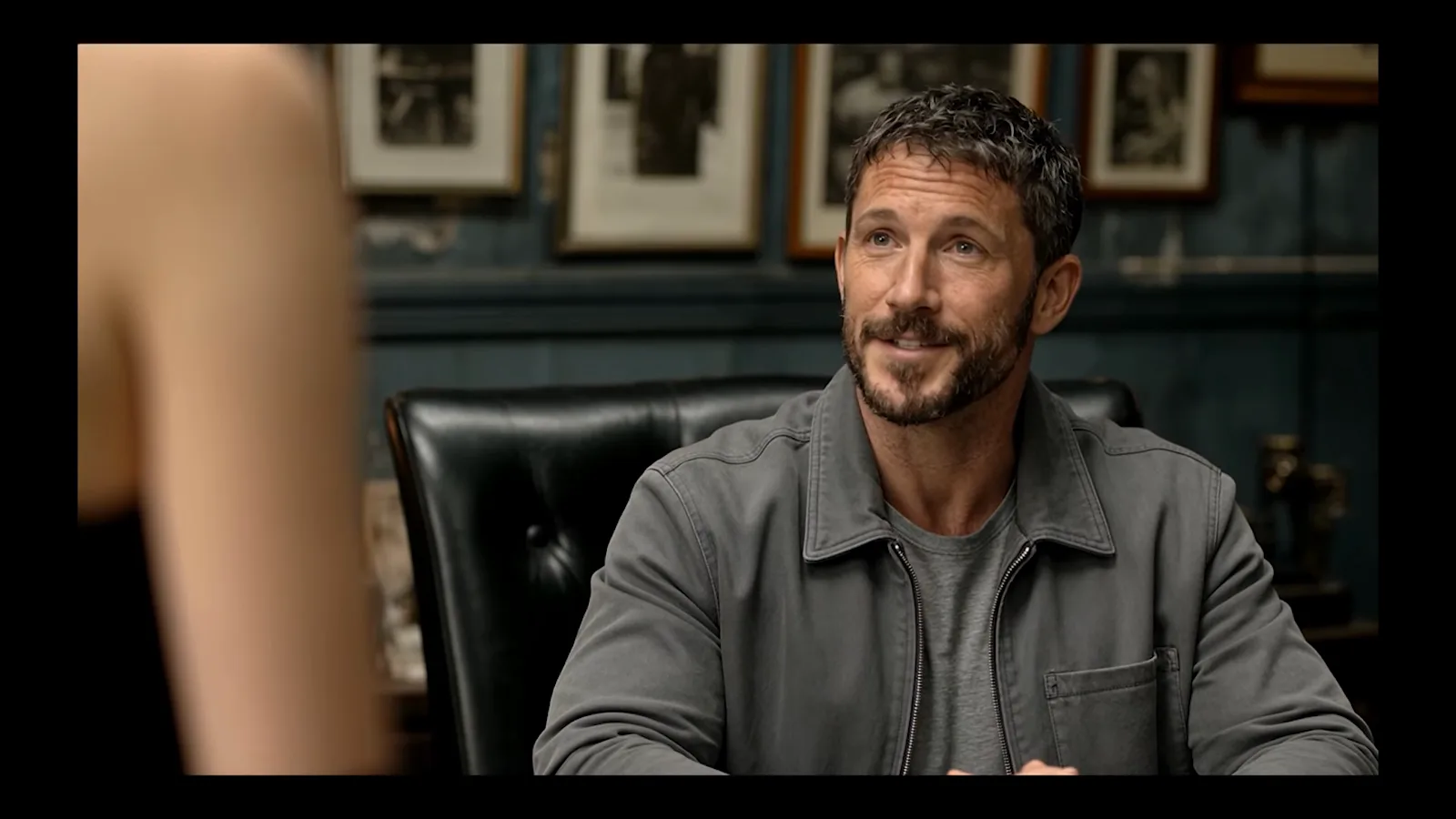 Kling 4 Omni output still of a bearded detective in the gray jacket the model added without being asked