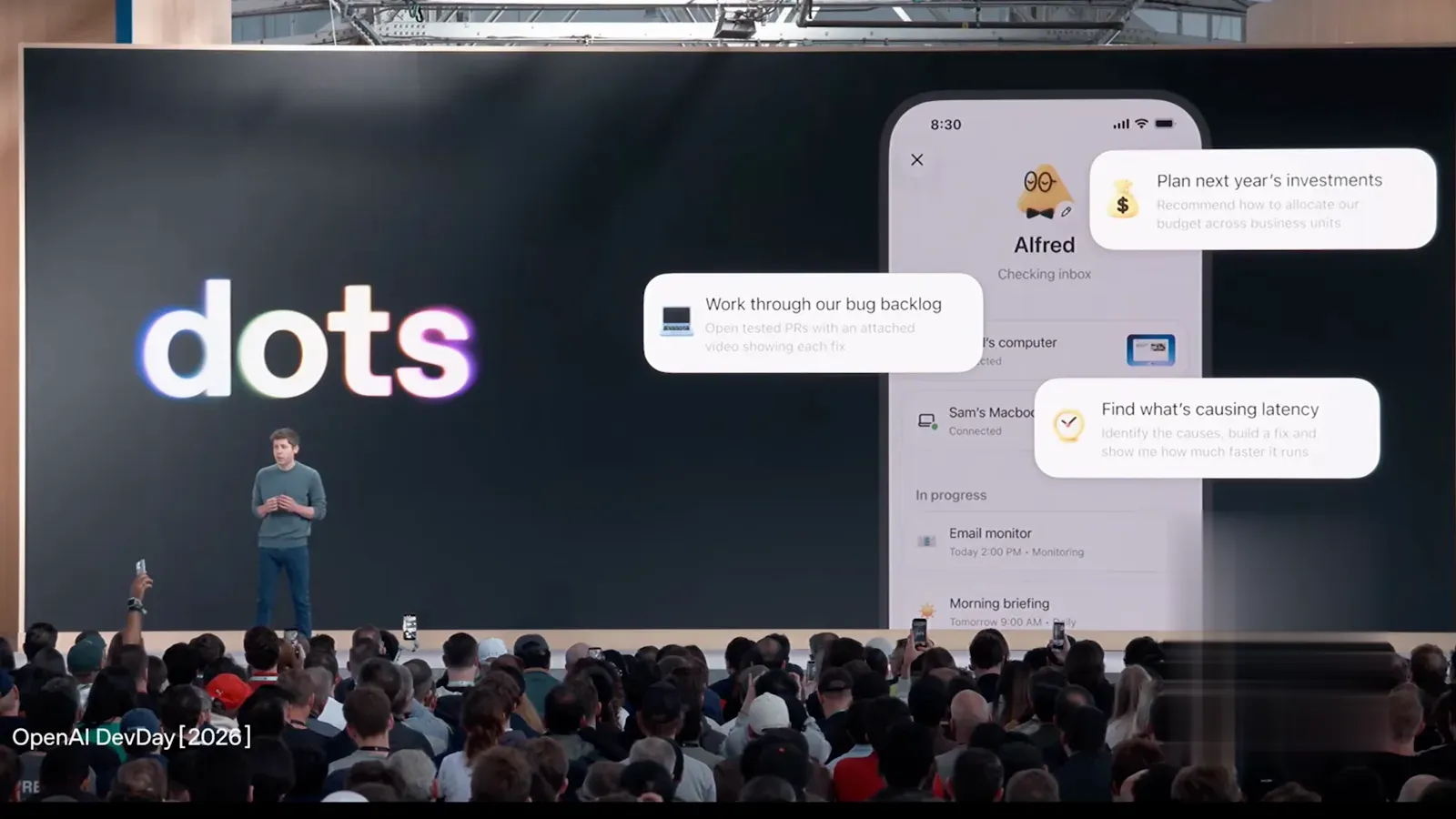DevDay 舞台大屏上的 dots 标志与手机端 dot 聊天演示画面 DevDay 舞台大屏上的 dots 标志与手机端 dot 聊天演示画面