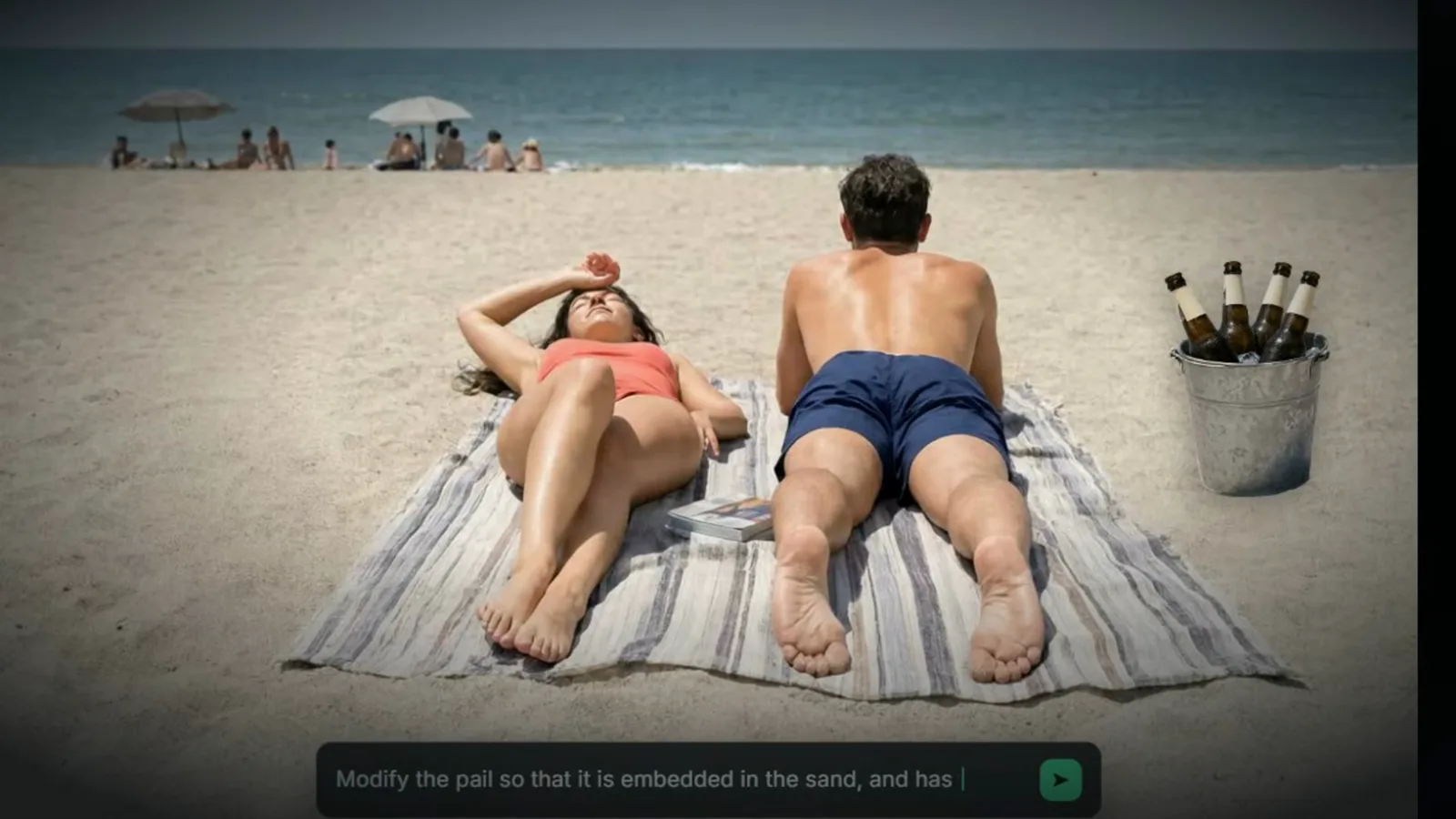 Beach photo edit demo showing a couple on a towel with an ice bucket of bottles and an instruction bar reading modify the pail so that it is embedded in the sand Beach photo edit demo showing a couple on a towel with an ice bucket of bottles and an instruction bar reading modify the pail so that it is embedded in the sand